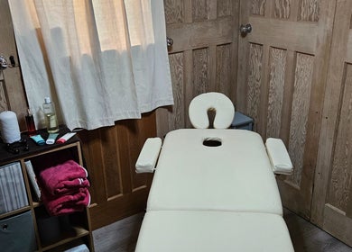 Cozy therapy room with treatment table at Apple Blossom Holistic Therapies, Bournemouth, England, GB.