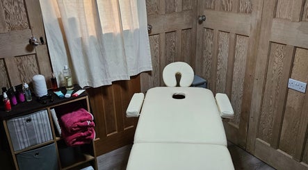 Cozy therapy room with treatment table at Apple Blossom Holistic Therapies, Bournemouth, England, GB.
