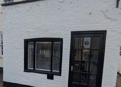 Front of Hair By Mel, a stylish salon located in Exning, England, GB, showcasing its modern exterior.
