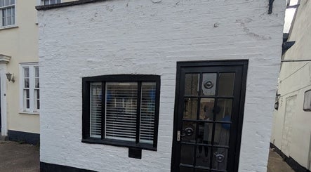 Front of Hair By Mel, a stylish salon located in Exning, England, GB, showcasing its modern exterior.