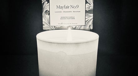 Scented candle lit at Ashby Woulds Beauty in Overseal, England, GB, creating a relaxing ambiance.