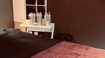 Relaxing spa room at Ashby Woulds Beauty with towels and products in Overseal, England, GB.