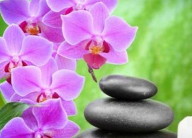 Relaxing spa setup with orchids and stones at Dessa Therapist, Grantham, England, GB.