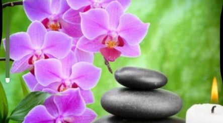 Relaxing spa setup with orchids and stones at Dessa Therapist, Grantham, England, GB.