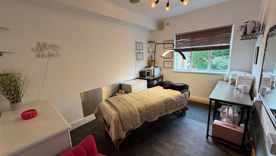 Cozy beauty room at Beauty by Jessica, Cheltenham, England, GB, featuring a massage table and relaxing decor.