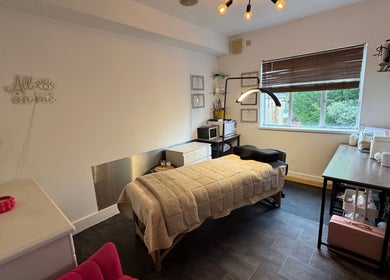 Cozy beauty room at Beauty by Jessica, Cheltenham, England, GB, featuring a massage table and relaxing decor.