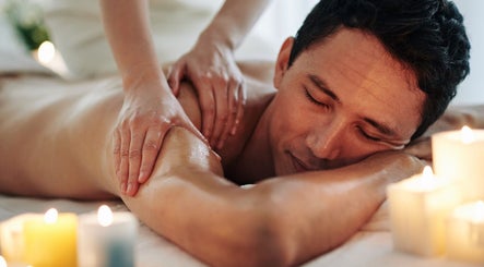 Man enjoying massage at Massage Center Spa Karachi - Massage Center Karachi, Karachi, Sindh, PK with candles.