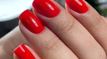 Close-up of vibrant red manicure at Beauty Studio Madam D, București, București, RO showcasing stylish design.