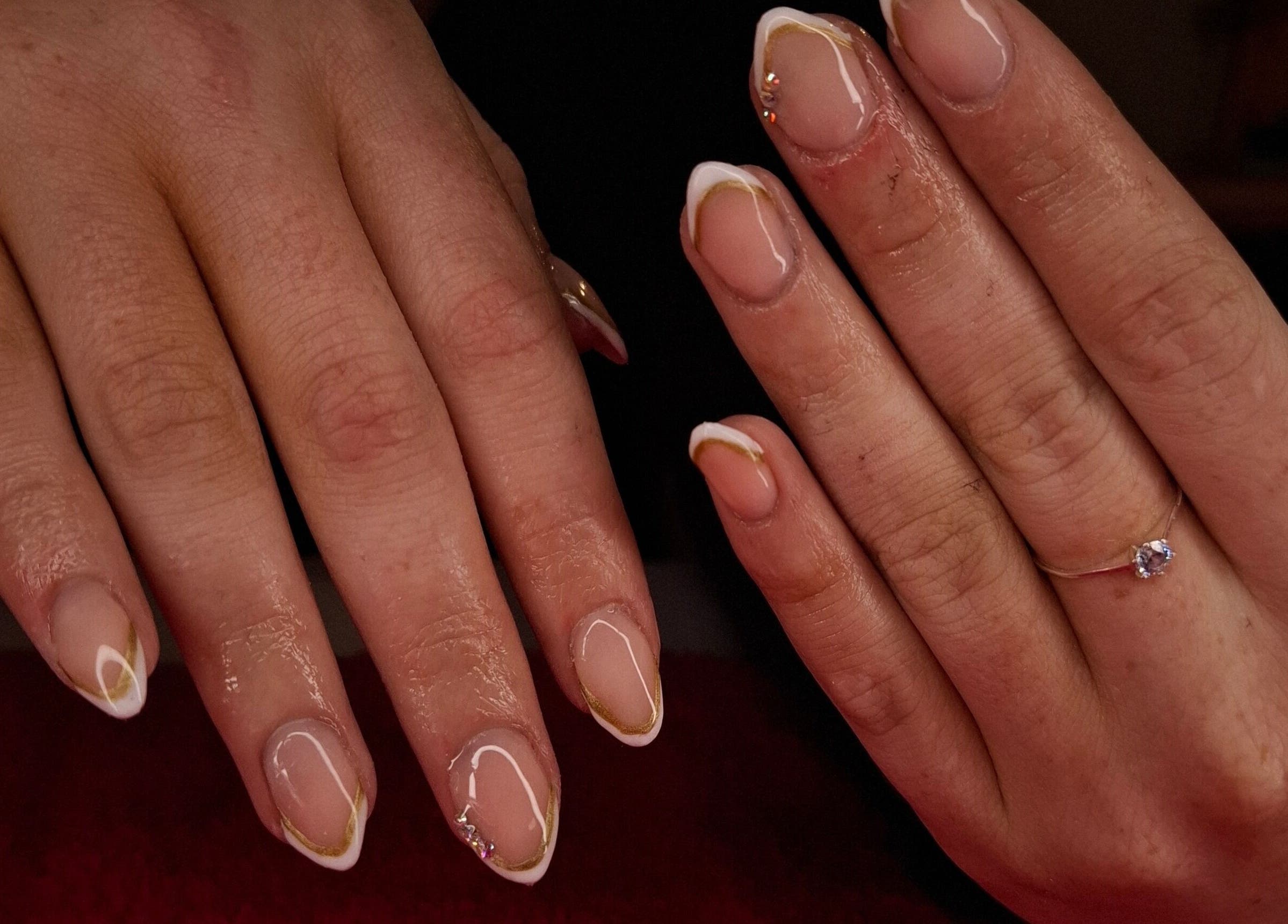 Elegant nail art featuring gold and white design at Boss Babes Beauty Lounge, Cape Town, Western Cape, ZA.