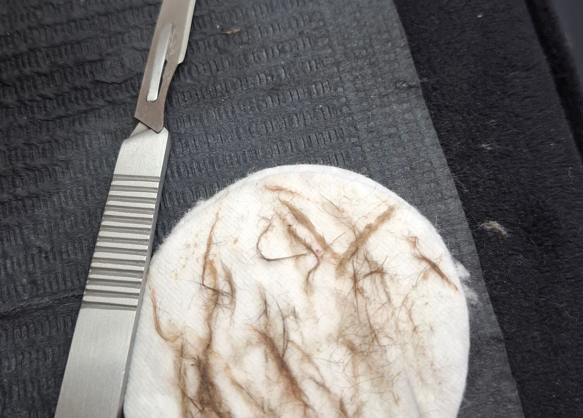 Dermaplaning tool with hair remnants at Boss Babes Beauty Lounge, Cape Town, Western Cape, ZA.