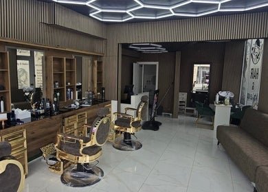 Elegant interior of Sextonbarber(Turkish style) in Kingston Upon Thames, England, GB featuring ornate chairs.