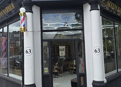 Exterior of Sextonbarber, Turkish style, at 63 Kingston Upon Thames, England, GB, showcasing stylish storefront.