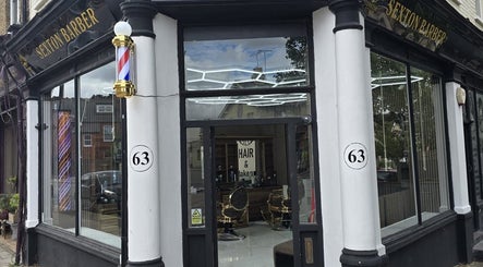 Exterior of Sextonbarber, Turkish style, at 63 Kingston Upon Thames, England, GB, showcasing stylish storefront.