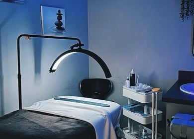 Serene treatment room at Eyelash Villa in Accra, Greater Accra Region, GH, featuring modern amenities and soft lighting.