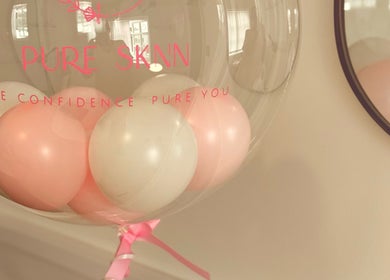 Decorative balloons at Pure SKNN, Warrington, England. Emphasizes elegance and confidence.