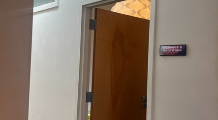 Doorway to Christine Gonzalez Massage at Studio IX in Charlottesville, Virginia, US, showcasing a serene entrance.