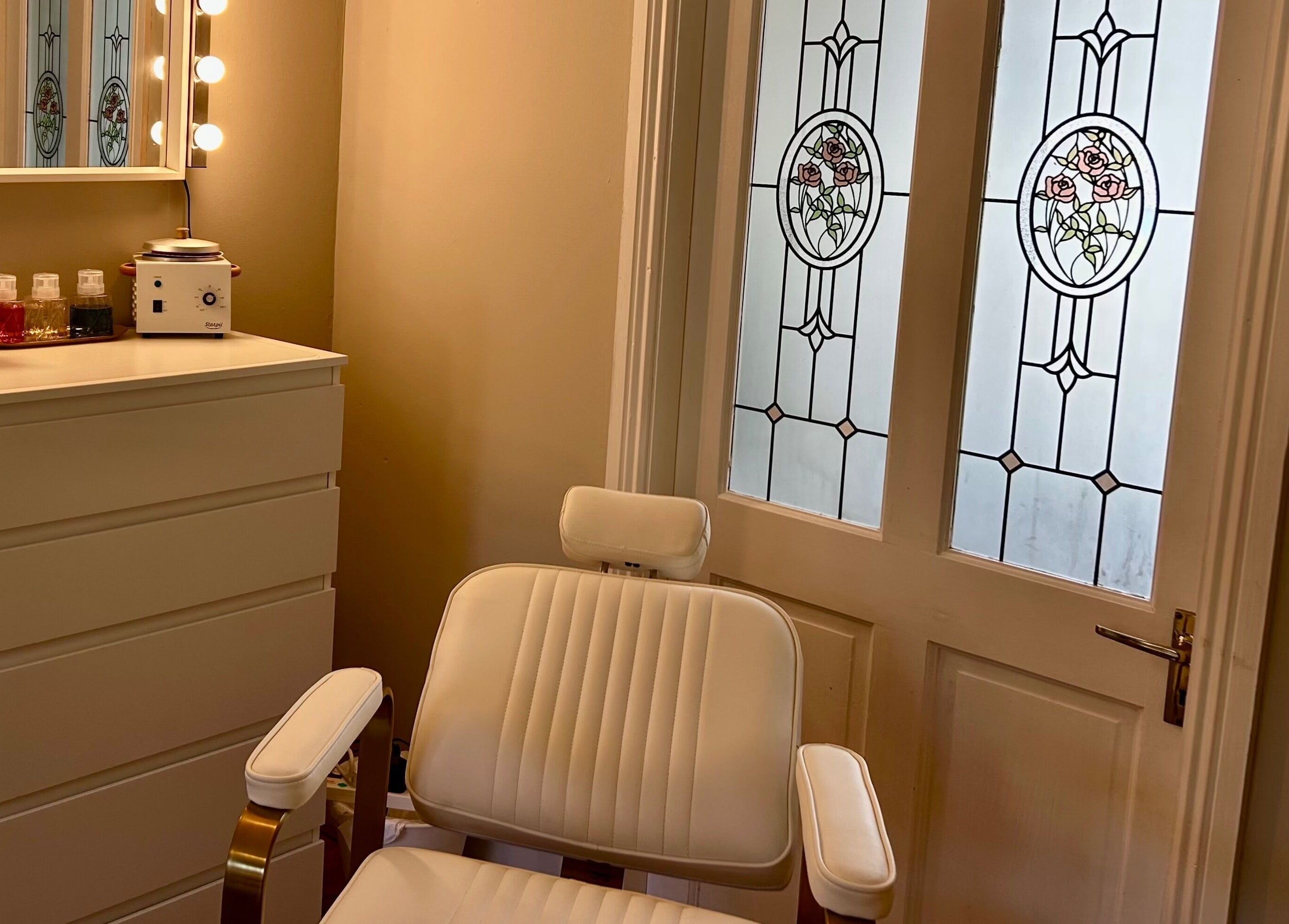 Chic beauty corner at Studio 25 by Sadhbh in Banagher, County Offaly, IE, featuring a stylish chair and vanity.