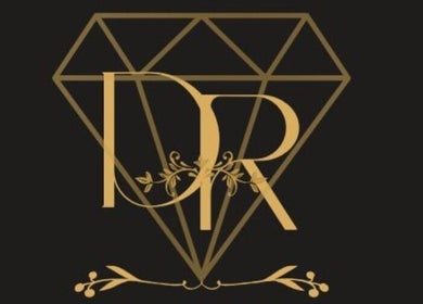 Elegant gold logo of Diaroyal’s Braids at CW, featuring intricate floral designs.