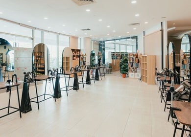 Modern interior of Kimage Salon in Singapore, Singapore, SG, showcasing sleek styling stations and large mirrors.
