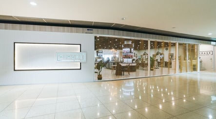 Kimage Salon's modern exterior view in Singapore, Singapore, SG showcasing its inviting glass facade.