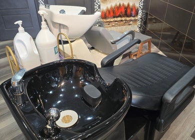 Modern hair washing station at Seoul Hair salon, Calgary, Alberta, CA, featuring sleek design and comfortable chairs.