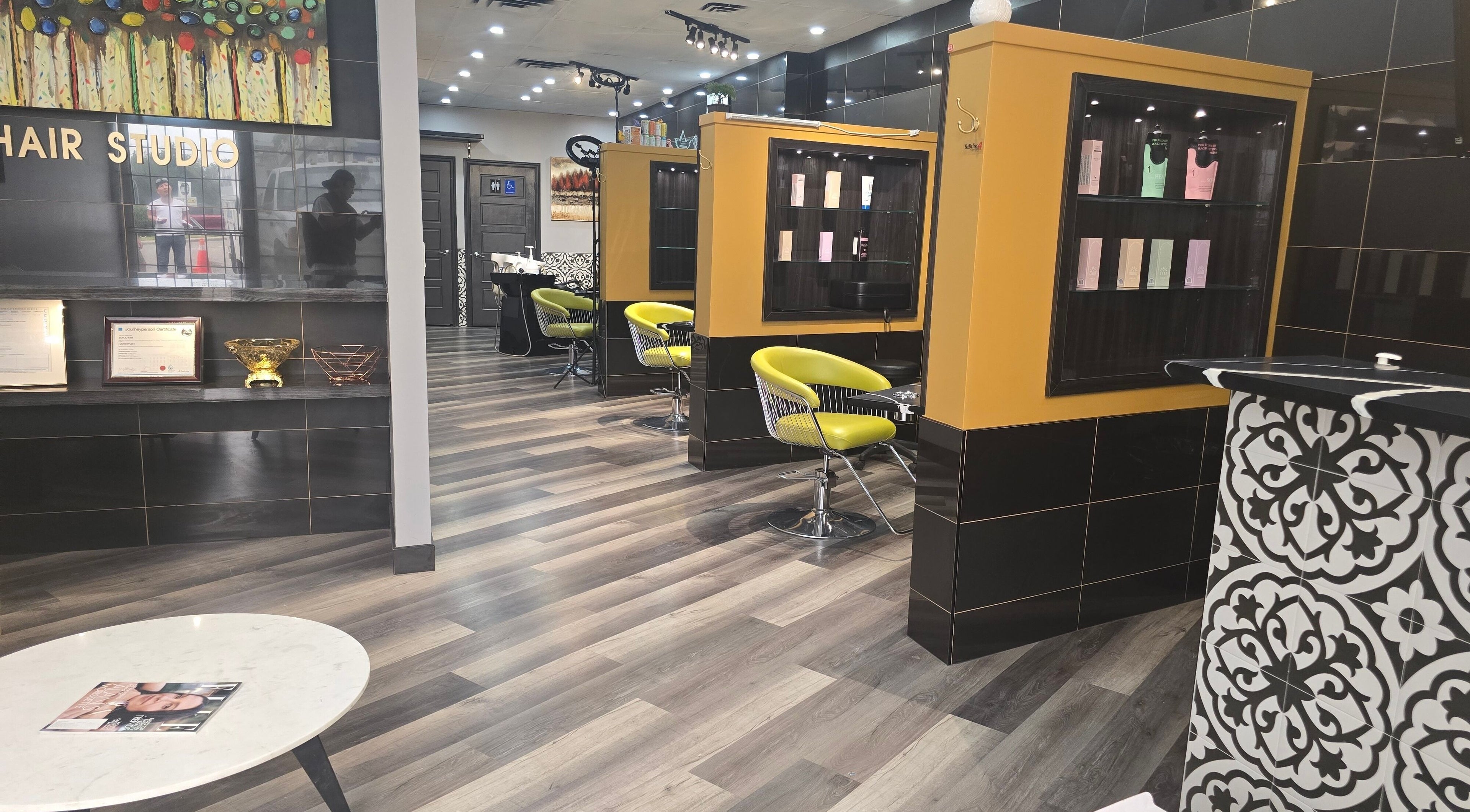 Interior of Seoul Hair salon in Calgary, Alberta, CA with modern chairs and sleek decor.