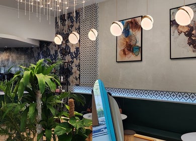 Elegant interior of Mimpi Headspa & Salon, Kuala Lumpur, showcasing modern decor and lush greenery.