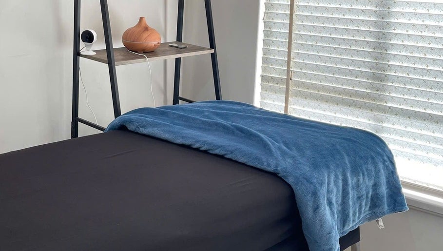 Cozy treatment room with blue blanket and diffuser at Mira Lash, Parafield Gardens, South Australia, AU.