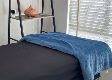 Cozy treatment room with blue blanket and diffuser at Mira Lash, Parafield Gardens, South Australia, AU.