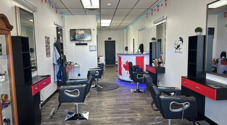Interior of Kawartha Barbershop in Peterborough, Ontario, CA, showcasing modern styling stations and decor.
