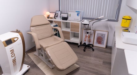 Calm treatment room at Nudia Skin Clinic, Melbourne, Victoria, AU, showcasing modern equipment and amenities.