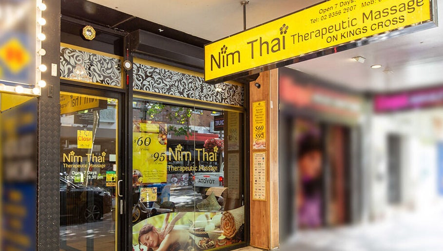 Entrance of NIM THAI Therapeutic Massage in Potts Point, New South Wales, AU, showcasing the vibrant signage.