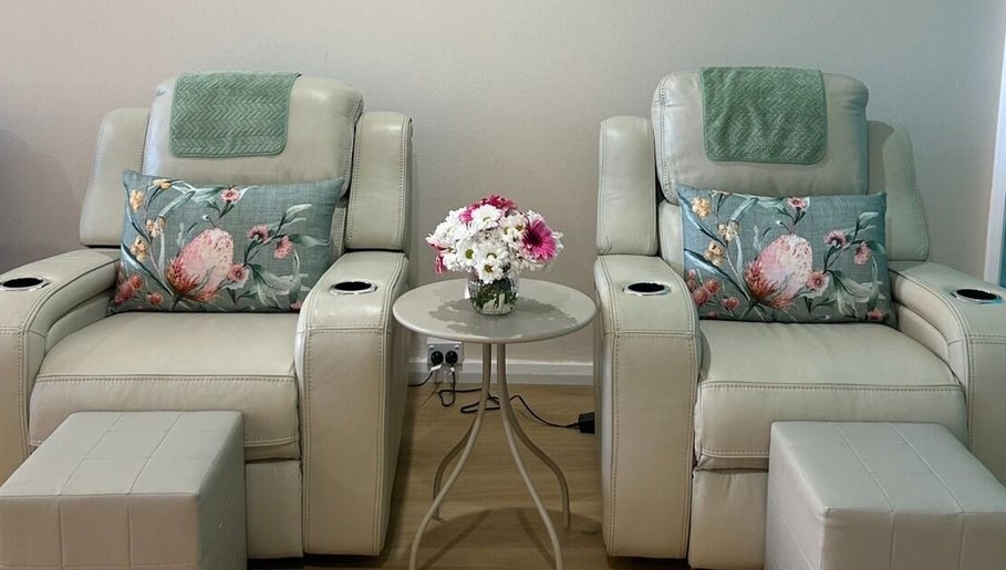 Relaxing massage chairs at TARA Thai & Remedial Massage, Darlinghurst, New South Wales, AU adorned with floral pillows.
