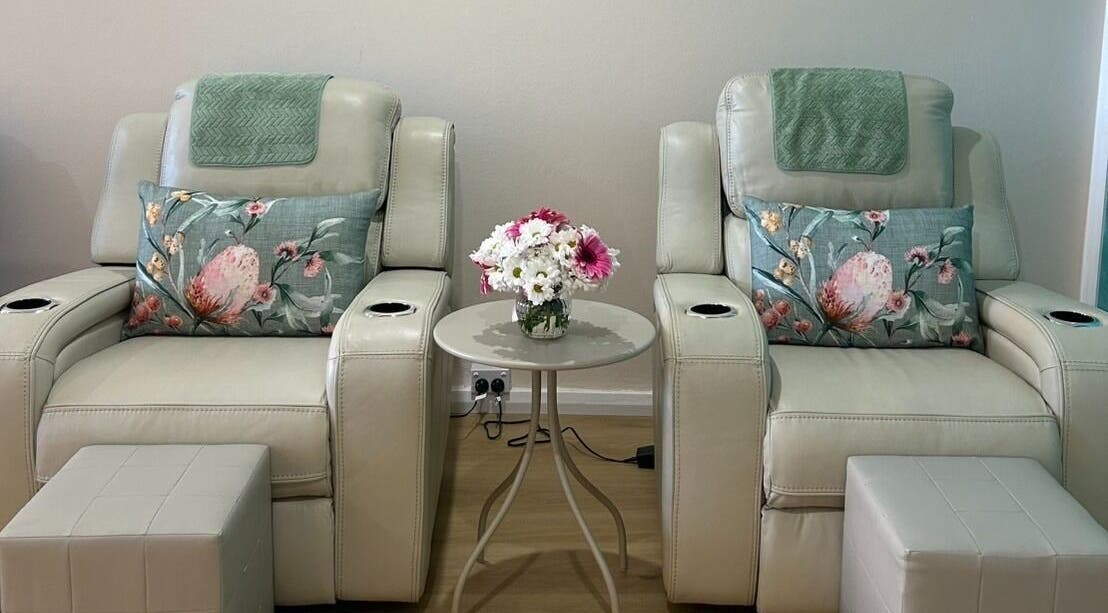 Relaxing massage chairs at TARA Thai & Remedial Massage, Darlinghurst, New South Wales, AU adorned with floral pillows.