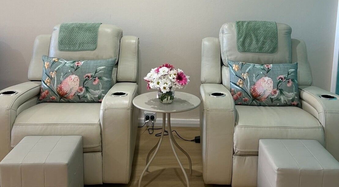 Relaxing massage chairs at TARA Thai & Remedial Massage, Darlinghurst, New South Wales, AU adorned with floral pillows.