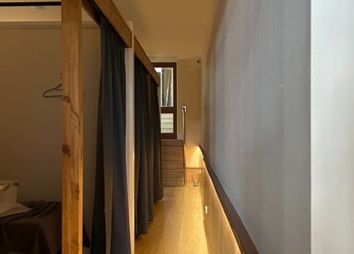 Calming hallway with wooden accents at TARA Thai & Remedial Massage, Darlinghurst, New South Wales, AU.