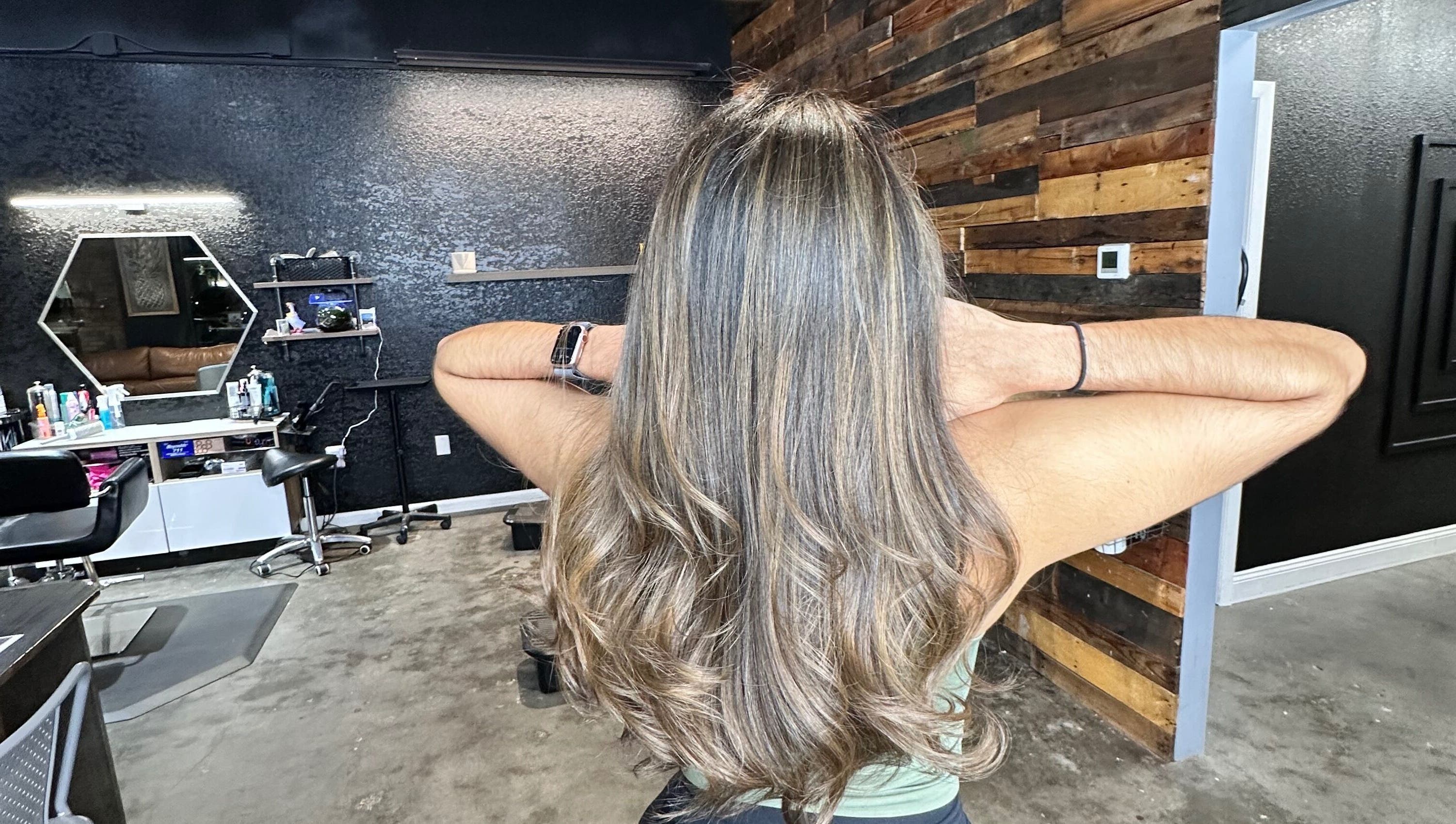 Luxurious hair treatment at Slay.it.te, Altamonte Springs, Florida, US, featuring elegant styling and decor.