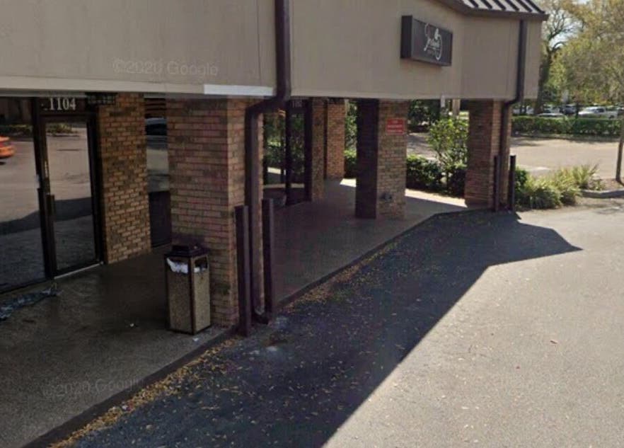 Entrance of Slay.it.te in Altamonte Springs, Florida, US, showcasing modern brick design.