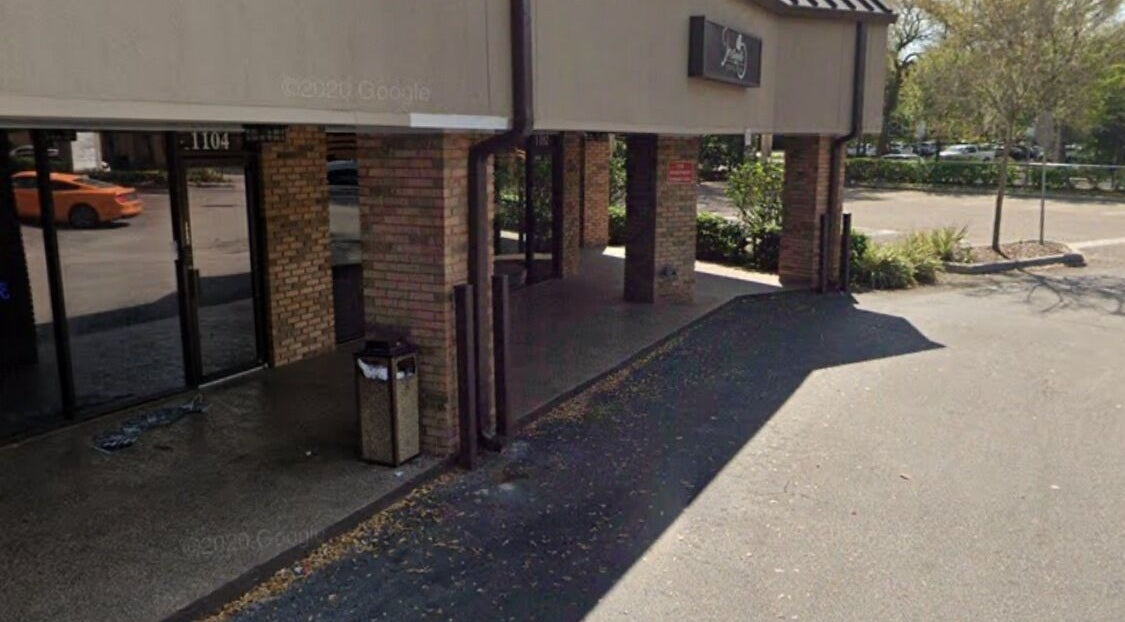 Entrance of Slay.it.te in Altamonte Springs, Florida, US, showcasing modern brick design.