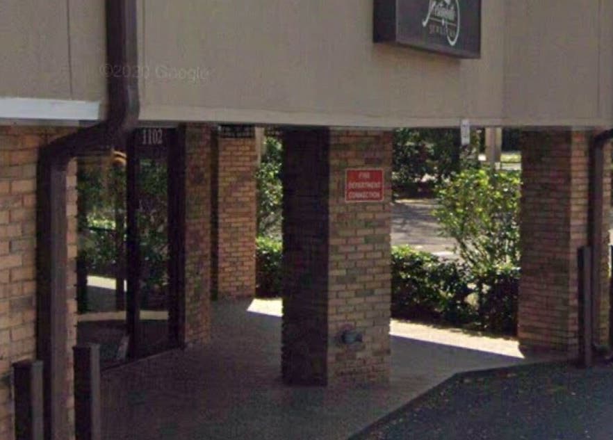 Entrance view of Slay.it.te at Altamonte Springs, Florida, US surrounded by greenery.