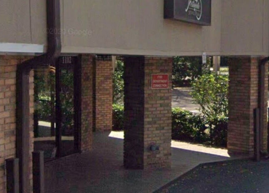 Entrance view of Slay.it.te at Altamonte Springs, Florida, US surrounded by greenery.