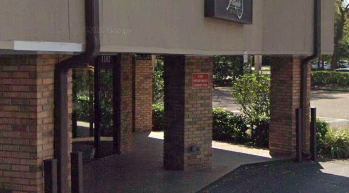 Entrance view of Slay.it.te at Altamonte Springs, Florida, US surrounded by greenery.