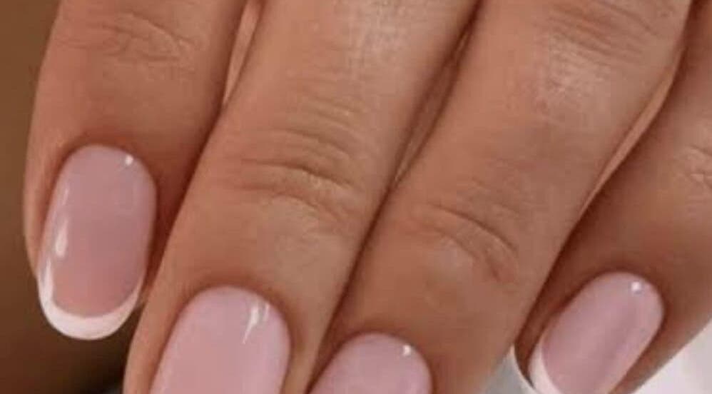 Close-up of elegant French manicure at Sanjula Bagdas Beauty Salon, Dubai, AE.