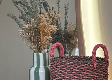 Elegant decor details at The Ladies Room, Lytham Saint Annes, England, GB featuring a vase and basket.