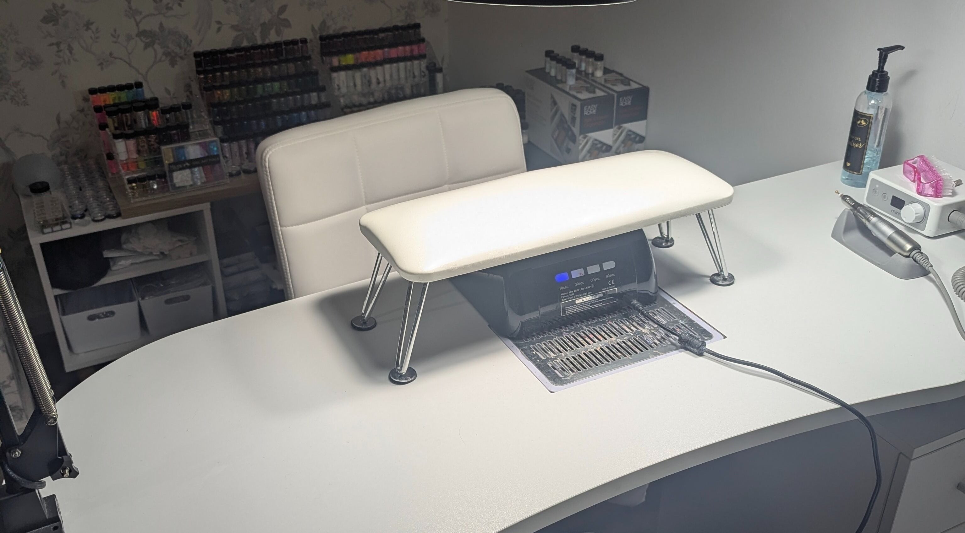 Tranquil manicure station at Louise's Nail Lounge, Stockton-on-tees, England, GB, featuring tools and polish display.