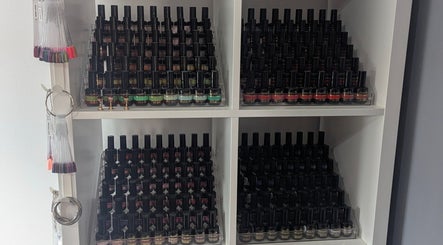 Colorful nail polish collection at Louise's Nail Lounge in Stockton-on-Tees, England, GB.