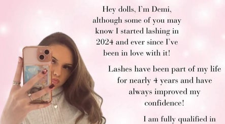 Selfie of a woman holding a phone with text about lash expertise at Dolls By Demi, Dagenham, England, GB.
