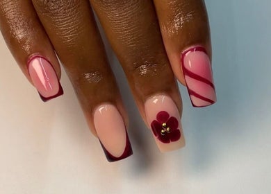 Detailed nail art at Haus of Nene, Boksburg, Gauteng, ZA featuring floral designs and pink hues.