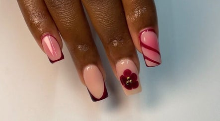 Detailed nail art at Haus of Nene, Boksburg, Gauteng, ZA featuring floral designs and pink hues.