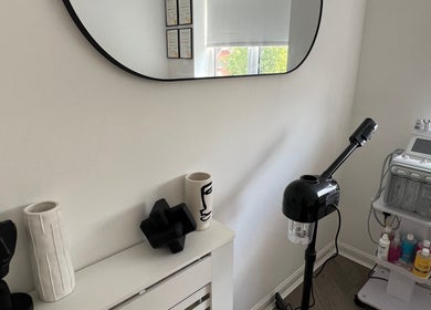 Modern skincare corner at Skinsbyygrace, Liverpool, England, GB, showcasing stylish decor and advanced facial equipment.